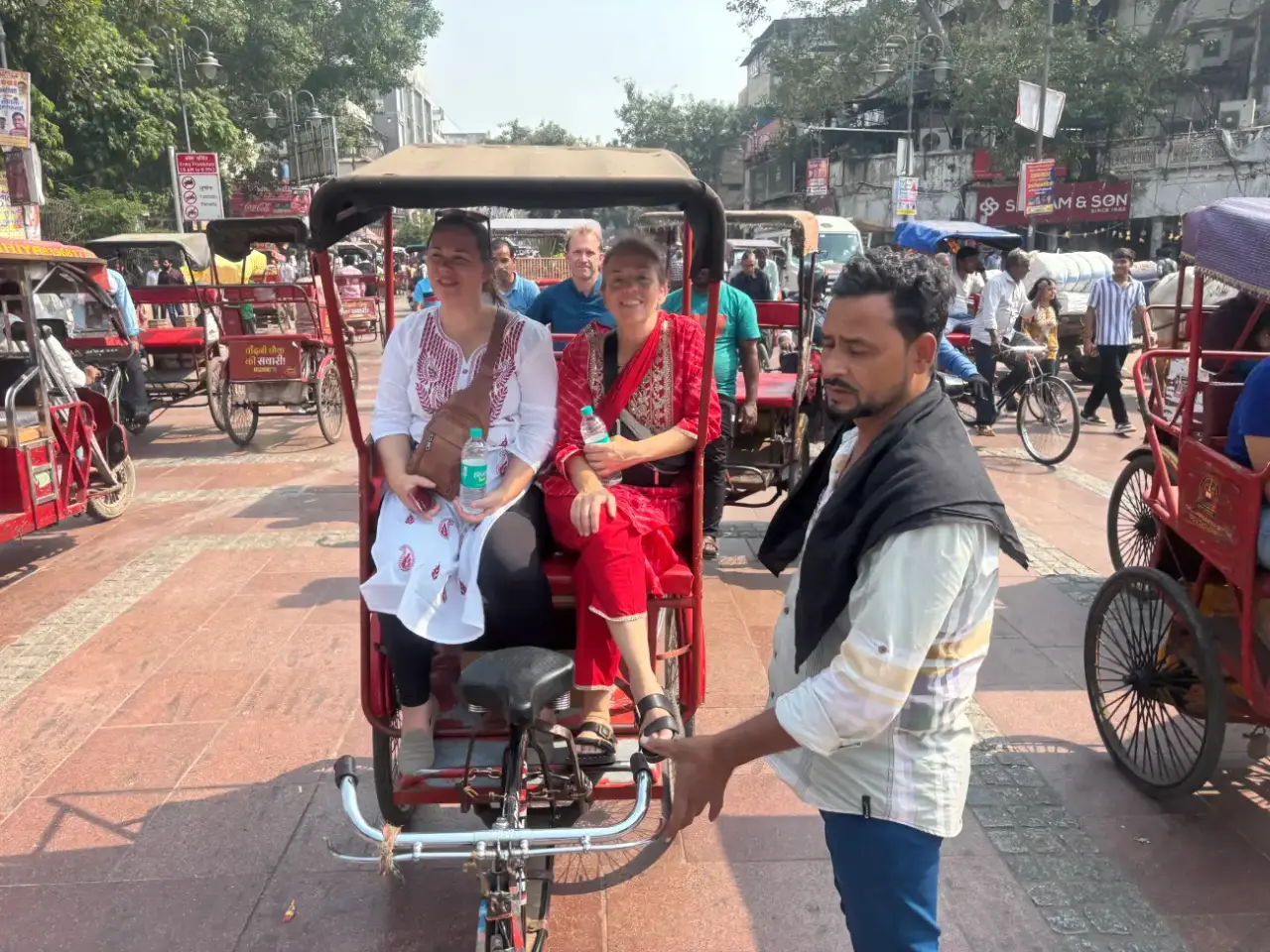 Tourists-Enjoying-a-Cycle-Rickshaw-Ride-in-Old-Delhis-Chandni-Chowk-Market (1)
